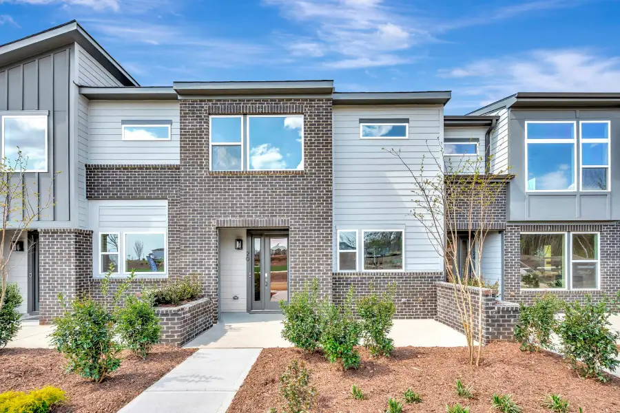 Front exterior of a new home in The Townes at NoVi, Pittsboro, NC, highlighting curb appeal (Image 1). Front exterior of a new home in The Townes at NoVi, Pittsboro, NC, highlighting curb appeal (Image 1).