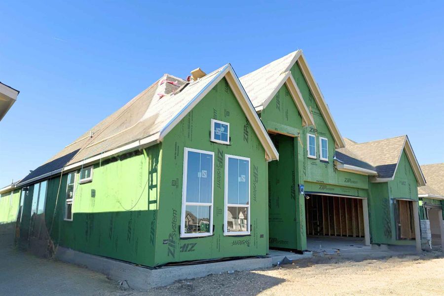 View of property exterior featuring a garage View of property exterior featuring a garage