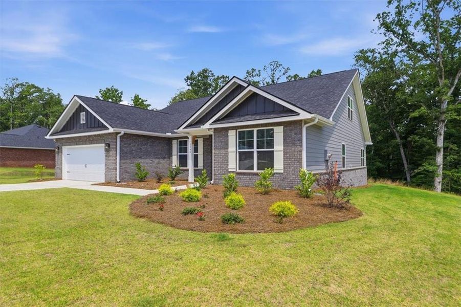 Front exterior of a new home in Tuscany Hills, Douglasville, GA, highlighting curb appeal (Image 18). Front exterior of a new home in Tuscany Hills, Douglasville, GA, highlighting curb appeal (Image 18).