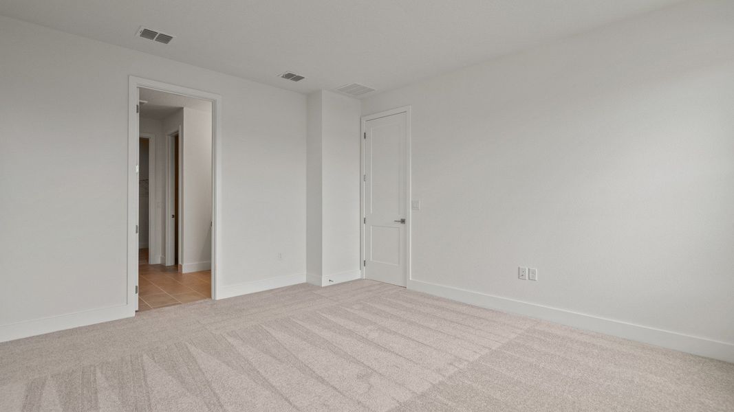 Bedroom in the Buttonwood floorplan by DRB Homes at Lakeside at Satilla in Saint Cloud, FL