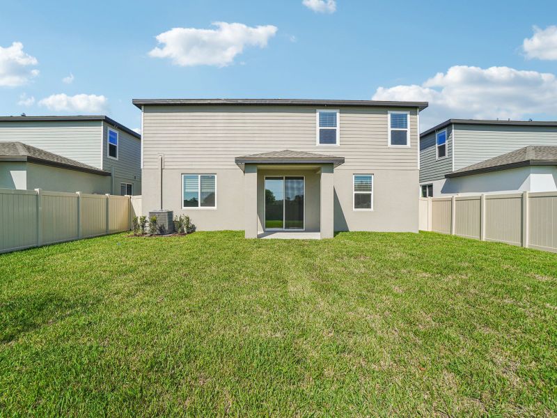 Exterior details and patio area of a home in Two Rivers - Classic Series, Zephyrhills (Image 3).