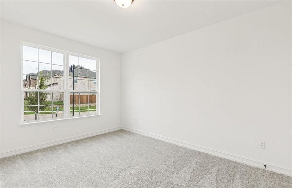 Convenient first-floor secondary bedrooms for easy access  *Real home pictured