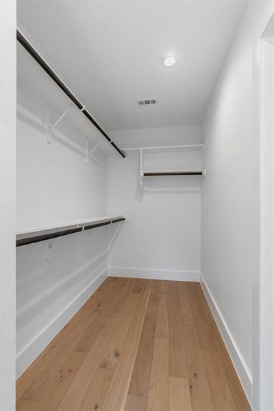 Huge primary walk-in closet.