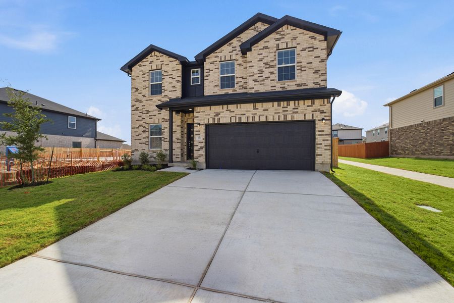Front exterior of a new home in Sunfield, Buda, TX, highlighting curb appeal (Image 26).