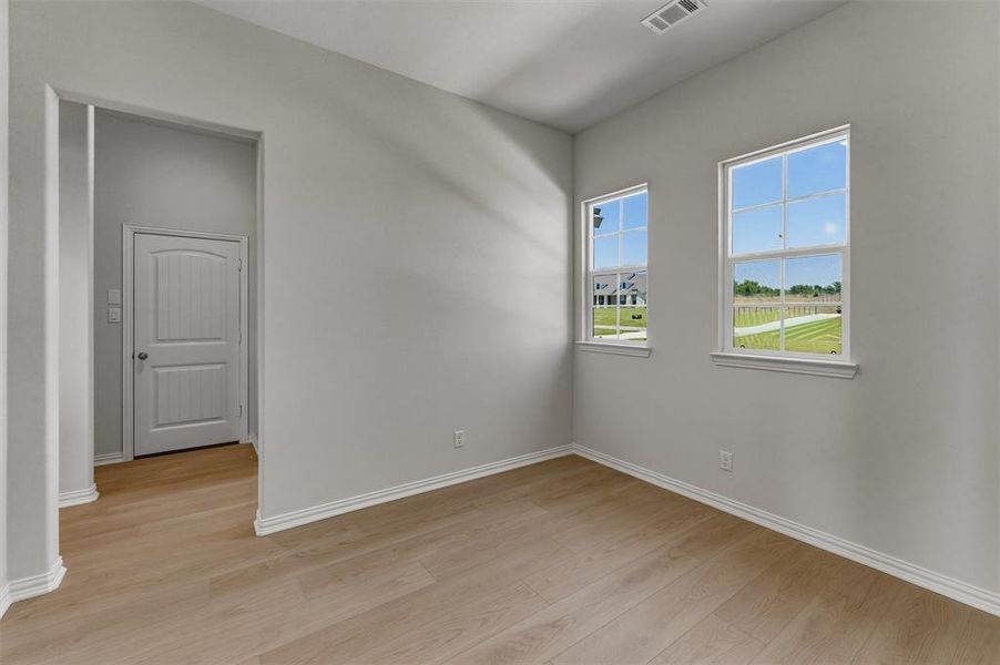 Neutral gray walls complement wood-finish flooring