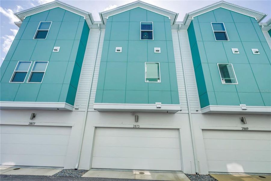 Front exterior of a new home in , St. Petersburg, FL, highlighting curb appeal (Image 1).