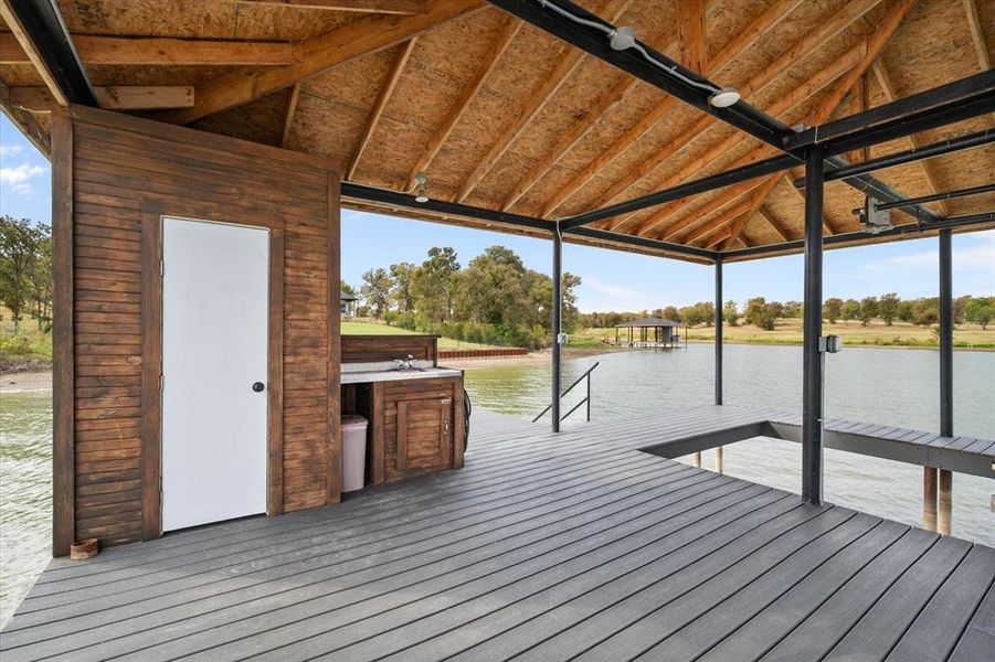 Boat dock with fish cleaning area and storage
