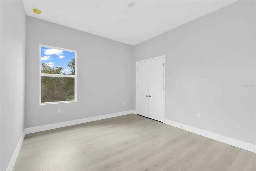 Spacious, unfurnished interior of a new home in , Port Charlotte (Image 24).