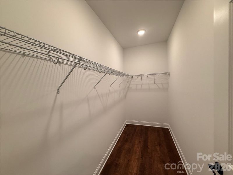 Spacious walk-in closet in the primary bedroom
