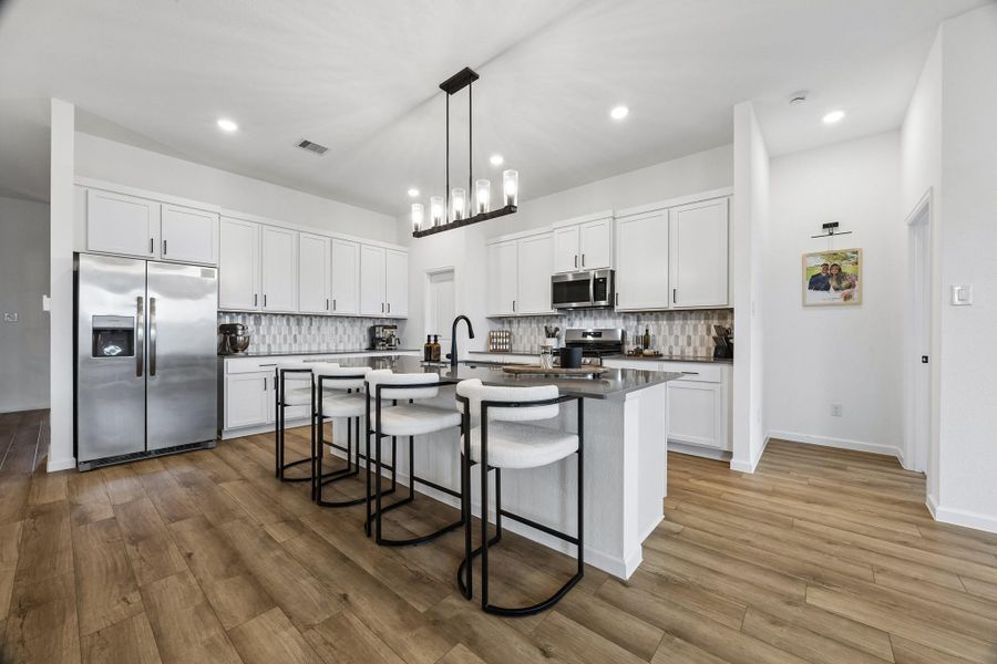 Ample storage with cabinets and walk-in pantry. Ample storage with cabinets and walk-in pantry.