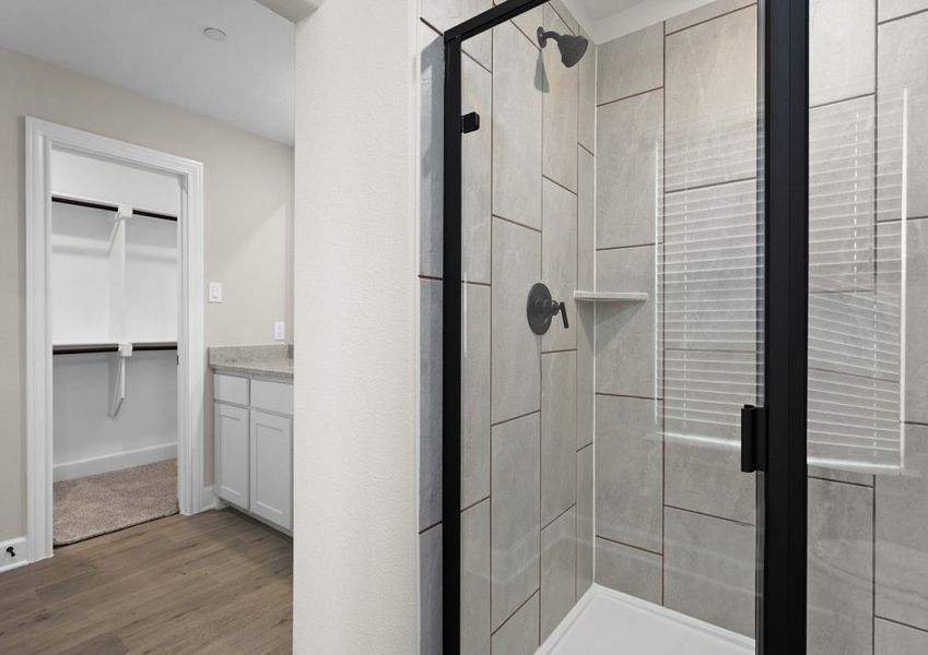 The master bathroom has a glass, walk-in shower.
