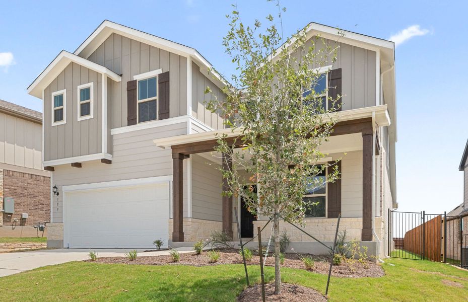 Front exterior of a new home in Saddleback at Santa Rita Ranch, Liberty Hill, TX, highlighting curb appeal (Image 21).
