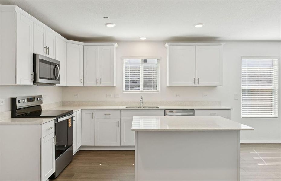 Spacious kitchen with eat-in bar top island Spacious kitchen with eat-in bar top island