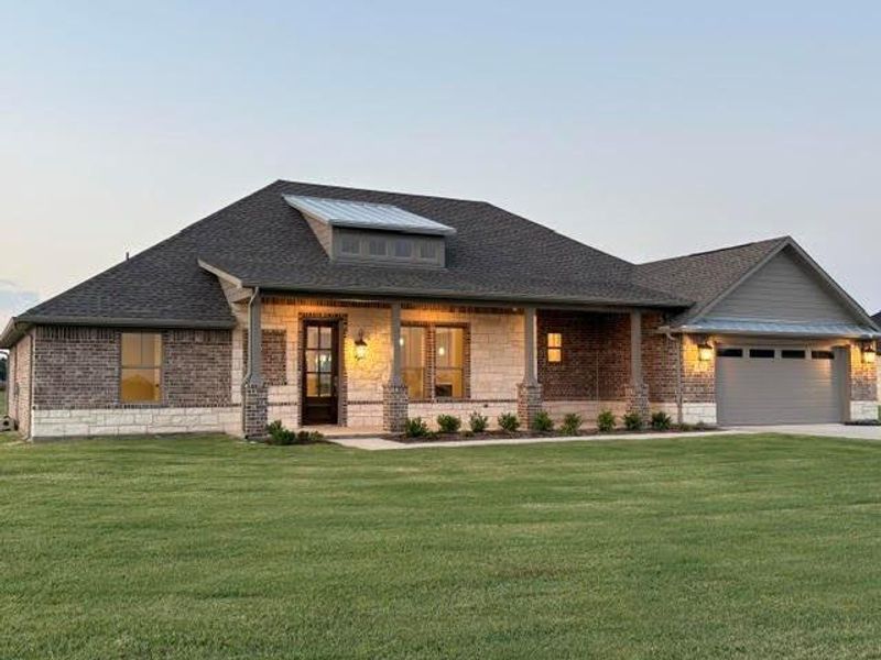 Front exterior of a new home in , Van Alstyne, TX, highlighting curb appeal (Image 21). Front exterior of a new home in , Van Alstyne, TX, highlighting curb appeal (Image 21).