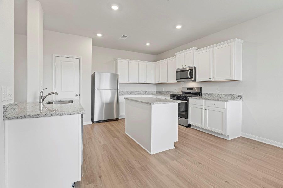 Furnished interior view inside a new home in , Iowa Colony (Image 4).