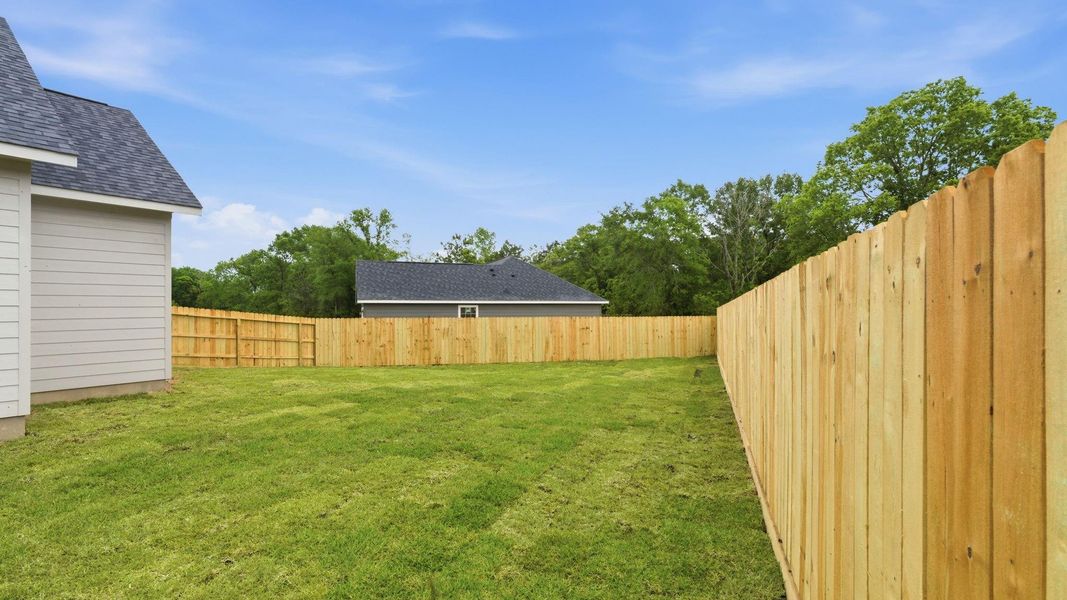 Exterior details and patio area of a home in , New Waverly (Image 20).