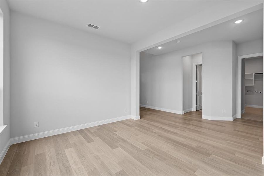 Spare room with recessed lighting, baseboards, and light wood-style flooring