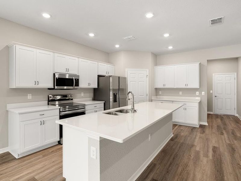 Your spacious kitchen features quartz, 36-inch cabinets, Samsung SS appliances, and a walk-in pantry.