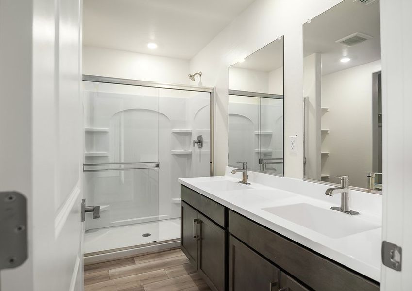 Primary bathroom with double vanity and walk-in shower in Wellton floor plan