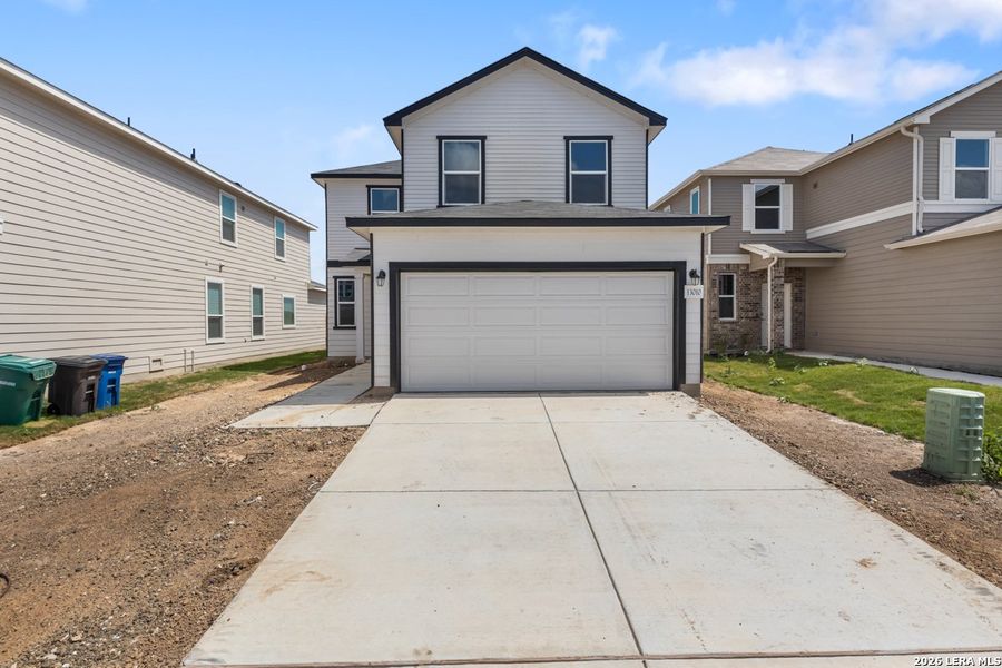Front exterior of a new home in Medina Crossing, Von Ormy, TX, highlighting curb appeal (Image 22).