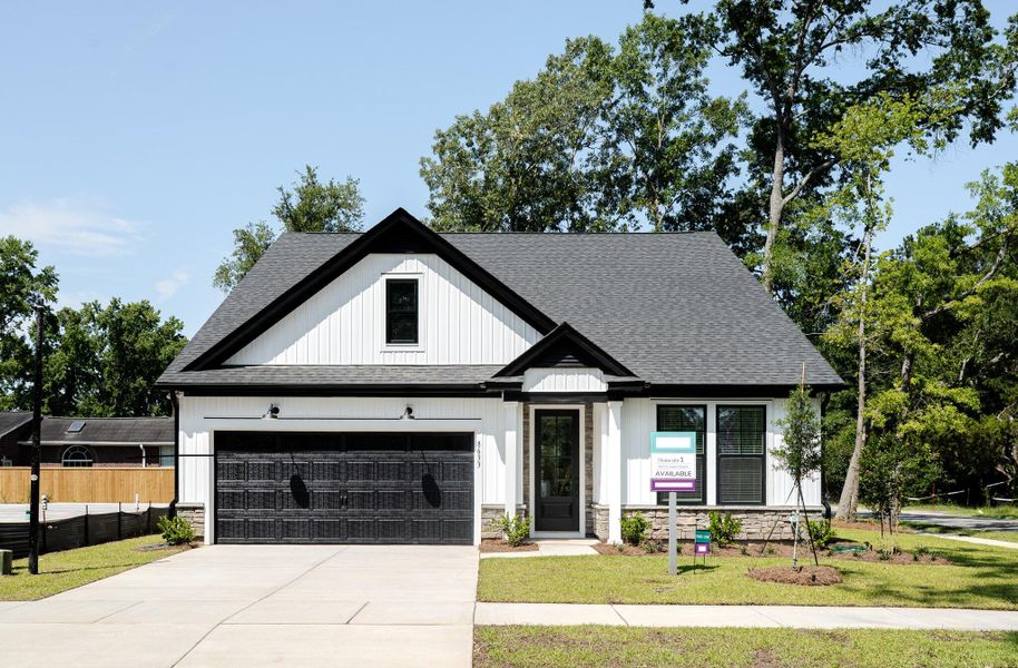 Front exterior of a new home in Indigo Place, North Charleston, SC, highlighting curb appeal (Image 1). Front exterior of a new home in Indigo Place, North Charleston, SC, highlighting curb appeal (Image 1).