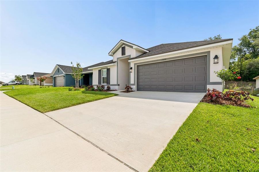 Front exterior of a new home in Abbey Glen, Dade City, FL, highlighting curb appeal (Image 35). Front exterior of a new home in Abbey Glen, Dade City, FL, highlighting curb appeal (Image 35).