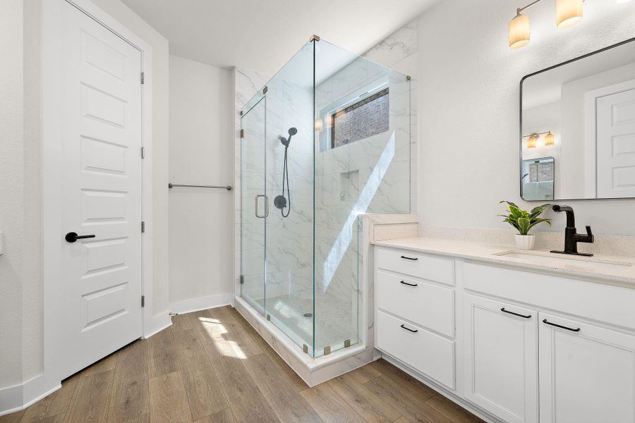 Double vanity, standing shower with bench seat