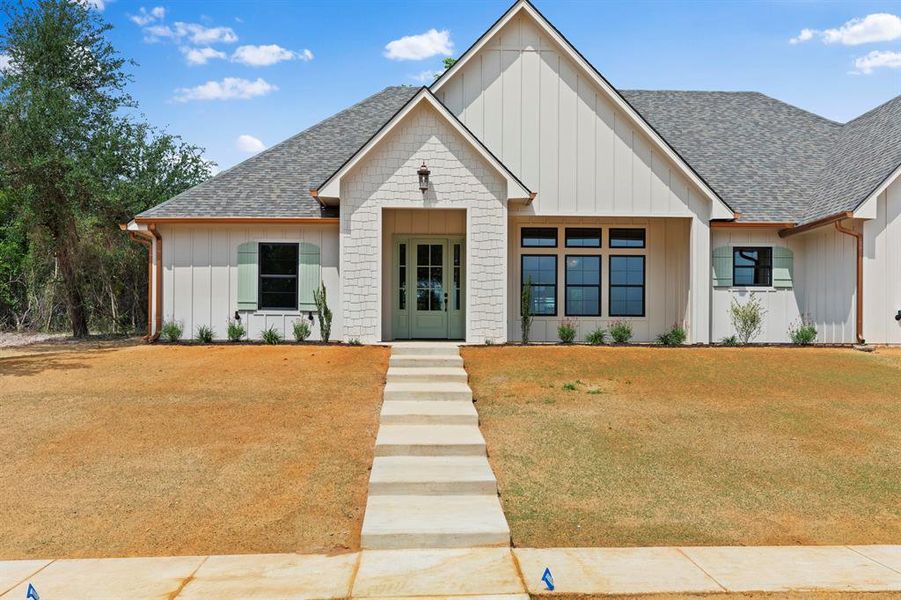 Front exterior of a new home in , Lindale, TX, highlighting curb appeal (Image 26).