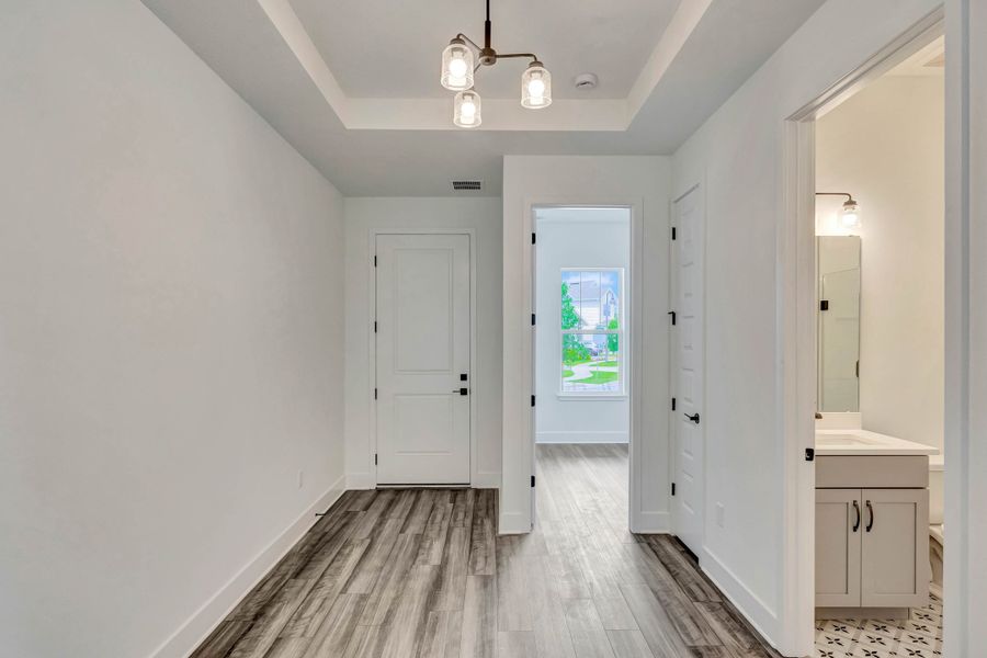 Representative unfurnished interior of a home built from the Faulkner by Rockwell Homes in Northlake At Ovation, Winter Garden (Image 22).