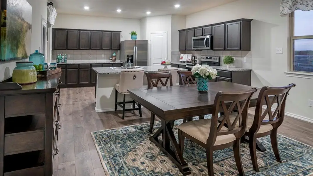 Dining space featuring light wood-type flooring and recessed lighting