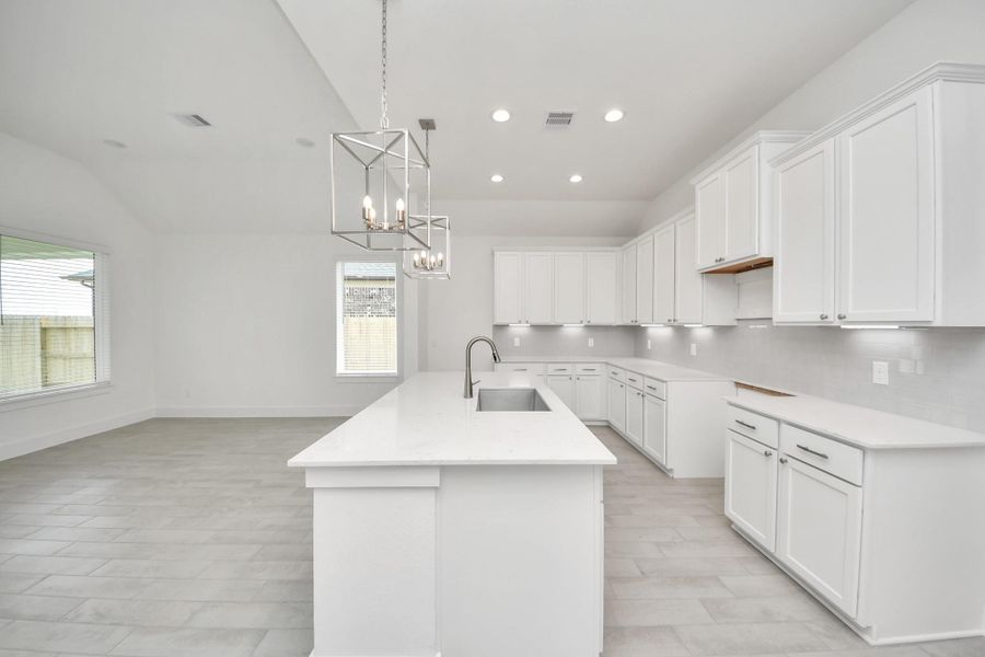 The extended counter area adds both practicality and style, making meal preparation a breeze. Every detail is thoughtfully designed to enhance the kitchen's functionality and aesthetic appeal. The extended counter area adds both practicality and style, making meal preparation a breeze. Every detail is thoughtfully designed to enhance the kitchen's functionality and aesthetic appeal.