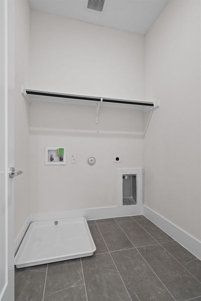 Laundry room featuring electric dryer hookup, washer hookup, and hookup for a gas dryer Laundry room featuring electric dryer hookup, washer hookup, and hookup for a gas dryer