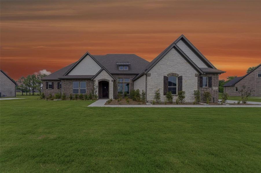 Brick and stone exterior with dark trim accents