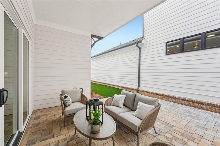 Exterior details and patio area of a home in Promenade at Sawnee Village, Cumming (Image 4).