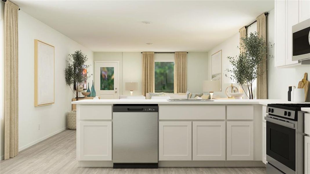 Kitchen with light hardwood / wood-style floors, white cabinetry, sink, and appliances with stainless steel finishes