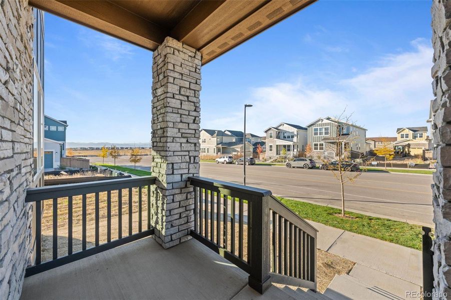 Exterior details and patio area of a home in Painted Prairie, Aurora (Image 26).