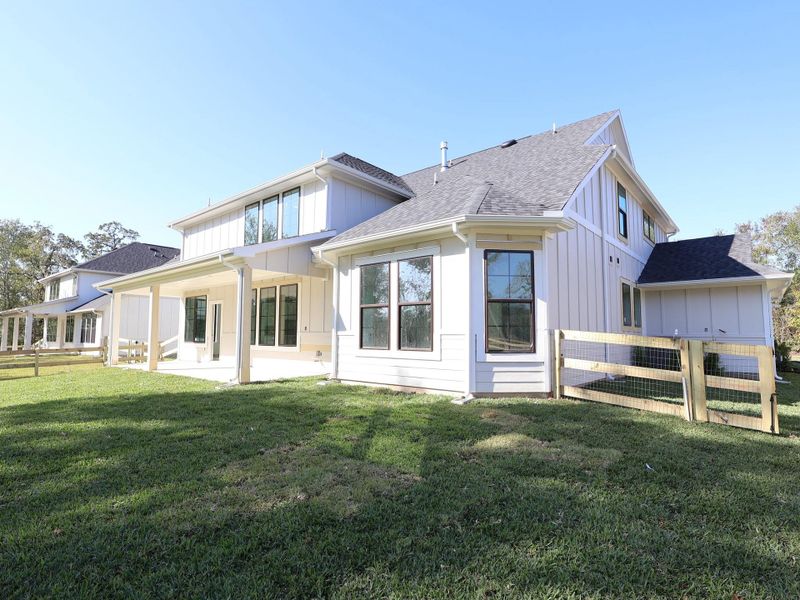 Exterior details and patio area of a home in The Oaks on 6th Street, Magnolia (Image 28).