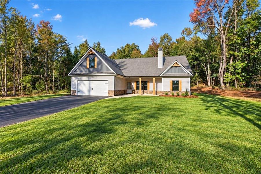 Front exterior of a new home in , Silver Creek, GA, highlighting curb appeal (Image 2). Front exterior of a new home in , Silver Creek, GA, highlighting curb appeal (Image 2).