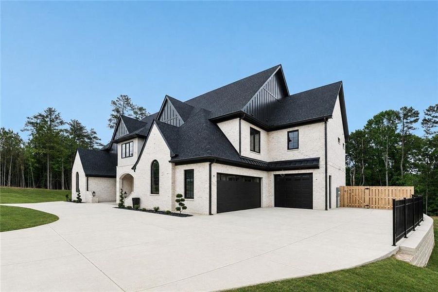 Front exterior of a new home in , Flowery Branch, GA, highlighting curb appeal (Image 1). Front exterior of a new home in , Flowery Branch, GA, highlighting curb appeal (Image 1).