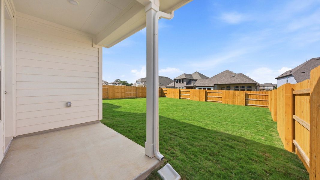 Exterior details and patio area of a home in Oaks at San Gabriel, Georgetown (Image 3).