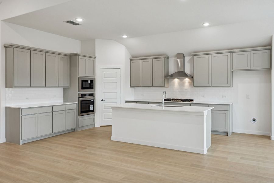 Kitchen in the Gilmour II home plan by Trophy Signature Homes – REPRESENTATIVE PHOTO