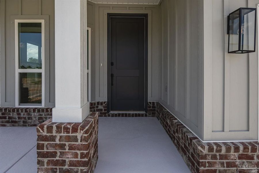 Exterior details and patio area of a home in Parkland Place, Pace (Image 3).