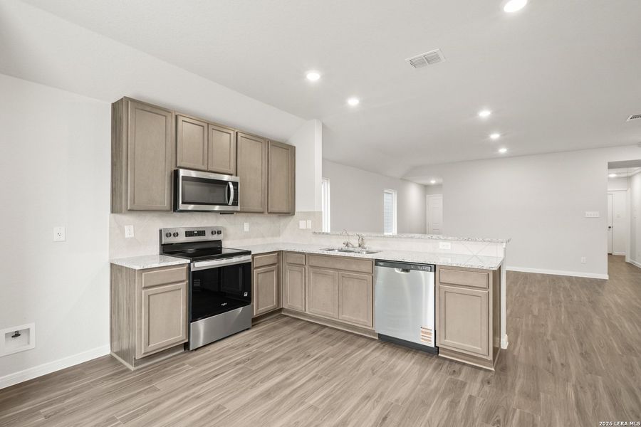 Furnished interior view inside a new home in Abbott Place, St. Hedwig (Image 9).