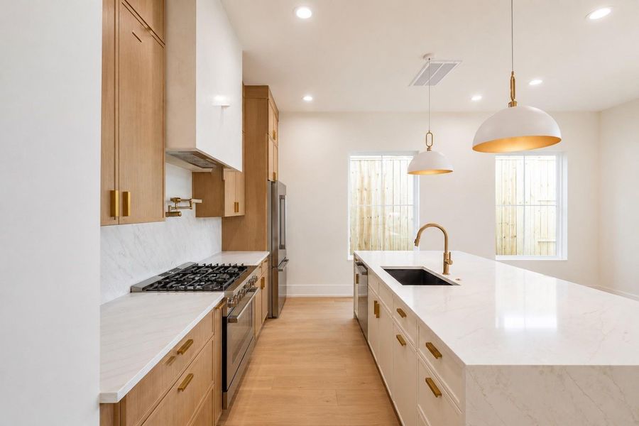 Chef's kitchen offers gas range and ample storage Chef's kitchen offers gas range and ample storage