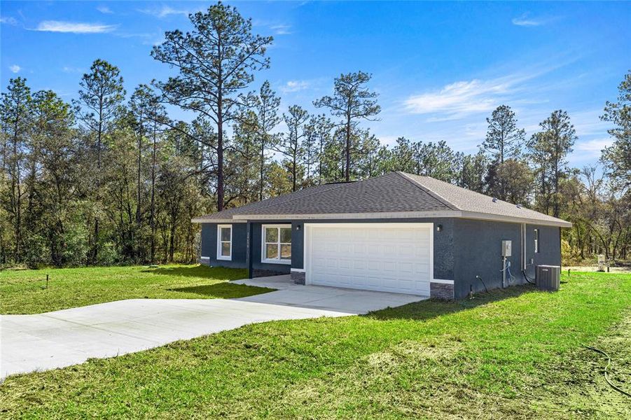 Front exterior of a new home in , Dunnellon, FL, highlighting curb appeal (Image 2). Front exterior of a new home in , Dunnellon, FL, highlighting curb appeal (Image 2).