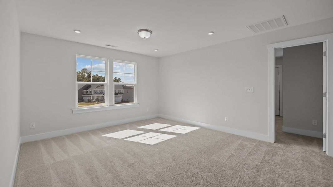 Burton Design bright and spacious bedroom with large windows at Lakeside Glen by premier builder DRB Homes in York, SC. Burton Design bright and spacious bedroom with large windows at Lakeside Glen by premier builder DRB Homes in York, SC.