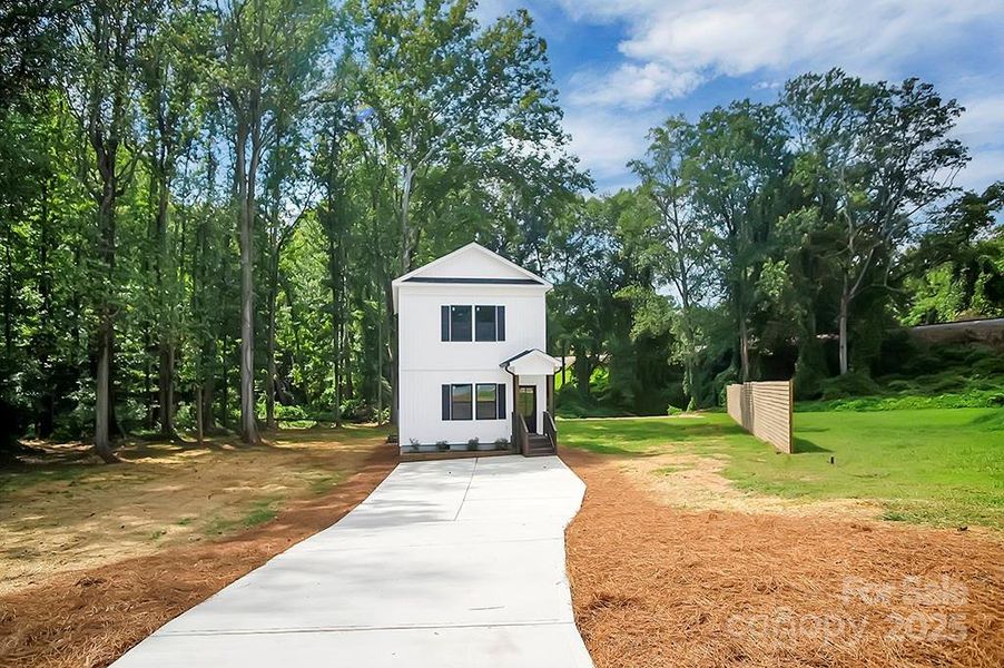 Front exterior of a new home in , Shelby, NC, highlighting curb appeal (Image 26).