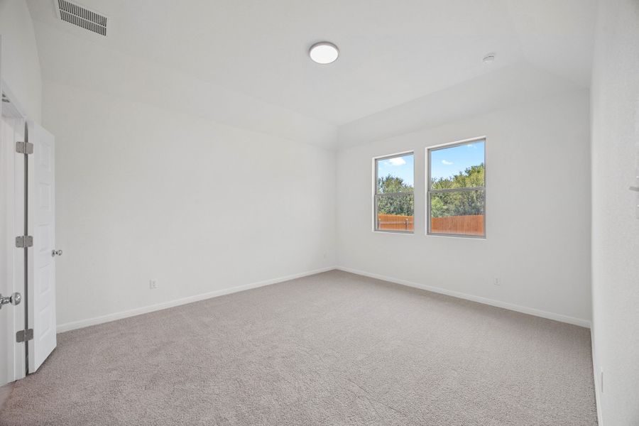 Primary Suite in the Elm home plan by Trophy Signature Homes – REPRESENTATIVE PHOTO