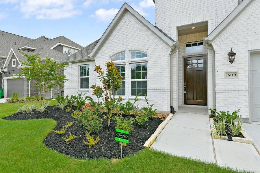 Front exterior of a new home in , Conroe, TX, highlighting curb appeal (Image 21).