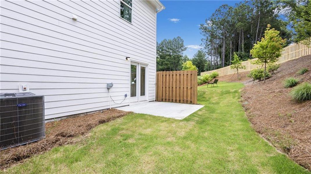 Exterior details and patio area of a home in Harvest Park, Decatur (Image 23).